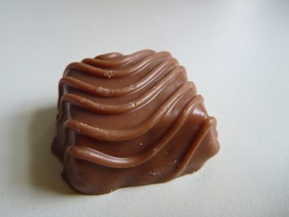small decorated brown chocolate candy