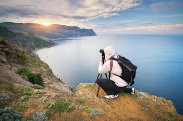 Photograph work in mountain.