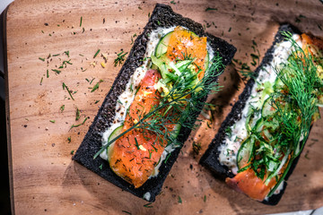 Charcoal Bread Smoked Salmon Sandwiches on wood board