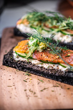 Charcoal Bread Smoked Salmon Sandwiches on wood board