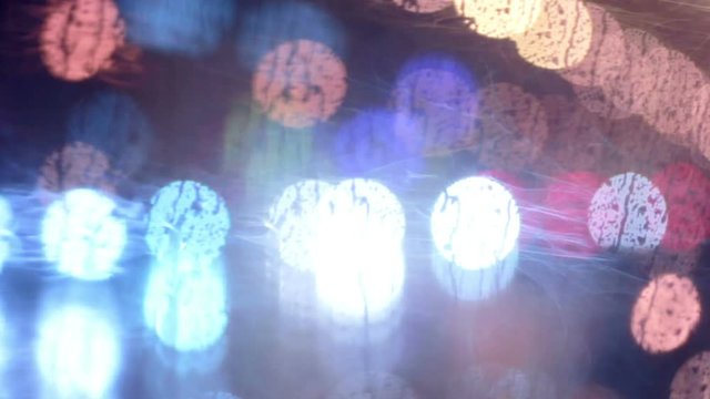 Colorful, blurred, bokeh lights background. Abstract sparkles, rain drops on window HD