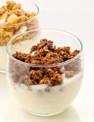 yogurt with chocolate  grain cereal  on white