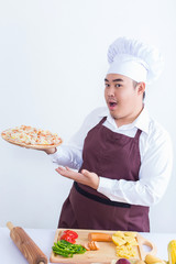 Portrait of a chef holding pizza