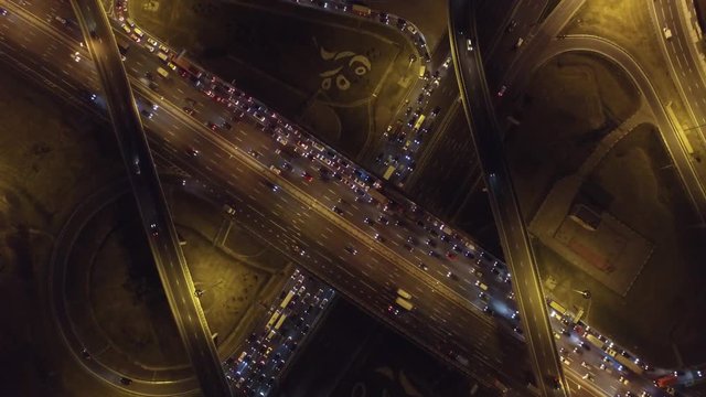 Complex road junction from above. Unique night aerial drone flight. Center of Europe modern Moscow. Evening road traffic, cars moving. High altitude footage. Best 4K video.