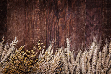 wooden background table ears of wheat