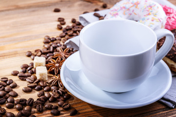 white mug grain coffee and donuts on a wooden background