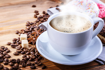 white mug grain coffee and donuts on a wooden background