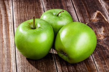 green apple fruit on a wooden background