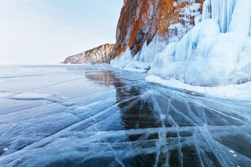 Icy rocks Olkhon Island on the frozen Lake Baikal. Winter landscape