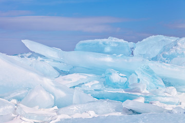Fototapeta na wymiar Clumps of blue ice. Ice hummocks on the frozen Lake Baikal