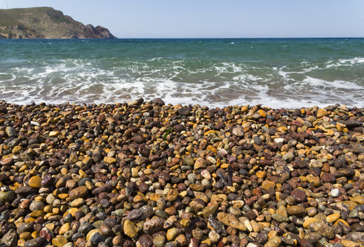 beach background, colorfull pebbles, Lampi beach, Patmos Greece