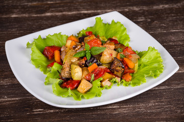 Vegetable stew in plate, close up.