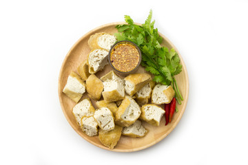 Fried tofu in wooden dish white background 