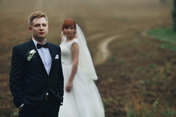 The couple in love stands in the park