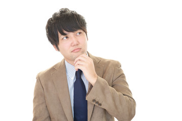 悩むビジネスマン