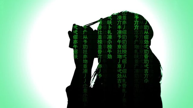 A woman putting on a virtual reality headset. Silhouette shot. Matrix-style sci-fi fx (falling text, code rain).
