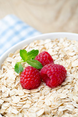 Oatmeal porridge with berries. Raspberries and blueberries.