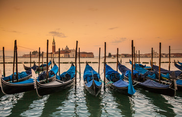 Fototapeta premium Gondolas moored by Saint Mark square - Venice during sunrise, Italy, Europe.