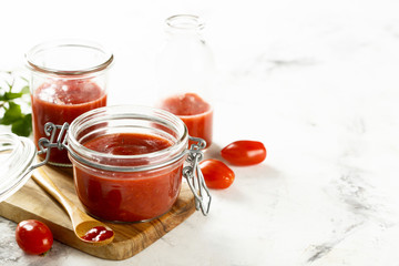 Homemade ketchup with tomatoes, chili and peaches