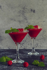 Red cocktail with raspberries.