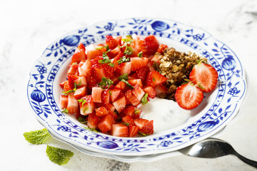 Homemade dessert with granola and berries