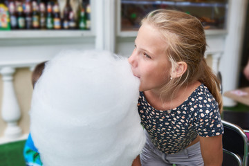 Girl eating big cotton candy