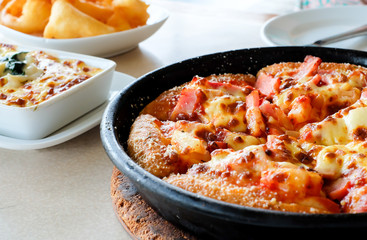 Hawaiian pizza on a table 