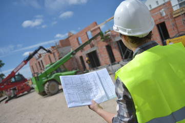 Foreman using walkie-talkie on construction site