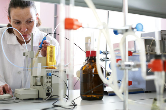 Girl chemist working in a chemical laboratory