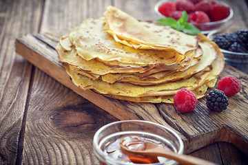 Pancake - Crepes with berries, mint and honey © circleps