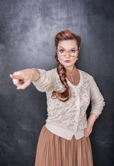 Angry teacher pointing out