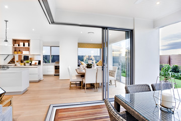 Modern dining  area and patio next to kitchen