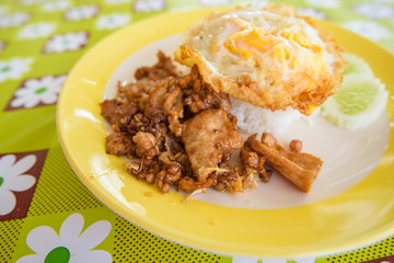 Pork fried garlic with rice and fried egg