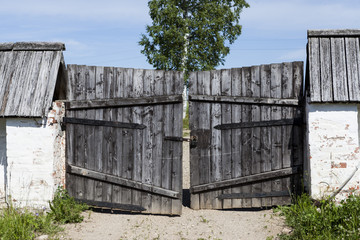 Closed old wooden gate in the countryside.