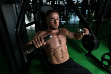 Fototapeta na wymiar Chest Exercise On Machine In A Gym