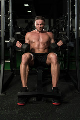 Fototapeta na wymiar Biceps Exercise In A Gym