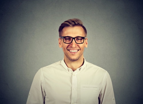 Young handsome man with great smile wearing fashion eyeglasses