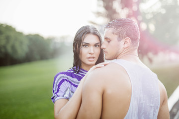 young couple in love having fun and enjoying the beautiful nature.Young couple in the rain