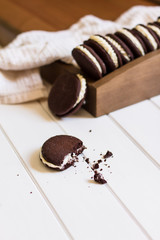 Chocolate cookies on white wooden background, horizontal
