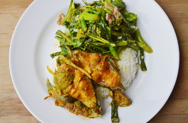 spicy curry fish and stir fried flower Chinese cabbage with pork on rice