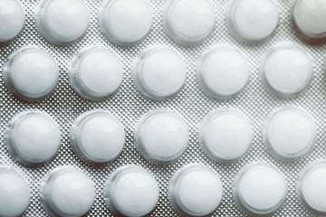 White round pills close up macro photo