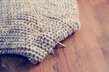 Fototapeta na wymiar knitting a scarf. vintage filter
