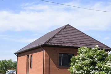 House with a roof made of metal sheets