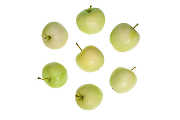 Small green apples on a white background