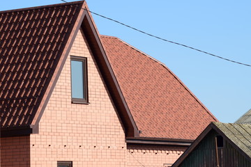 Obraz premium House with a roof made of metal sheets