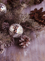 Christmas balls with fir branches and glasses of champagne