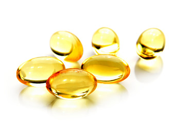 Fish oil pill on white background