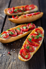 Bruschetta with tomatoes and greens