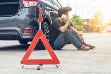 Man Phoning For Help with a broken down car