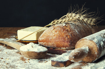 Bread and additions on a wooden table